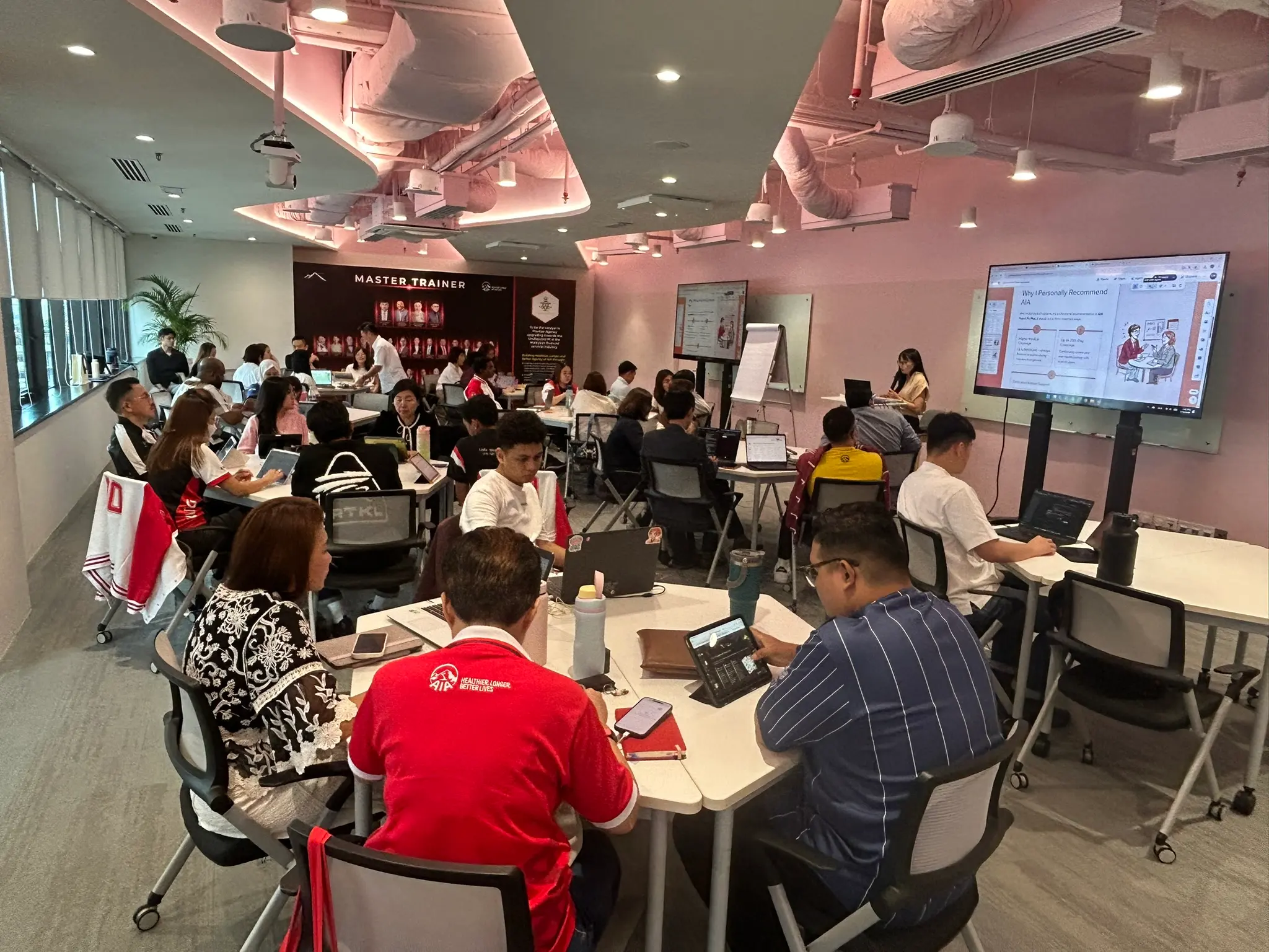 Advisors working at their laptops during the Kuala Lumpur session