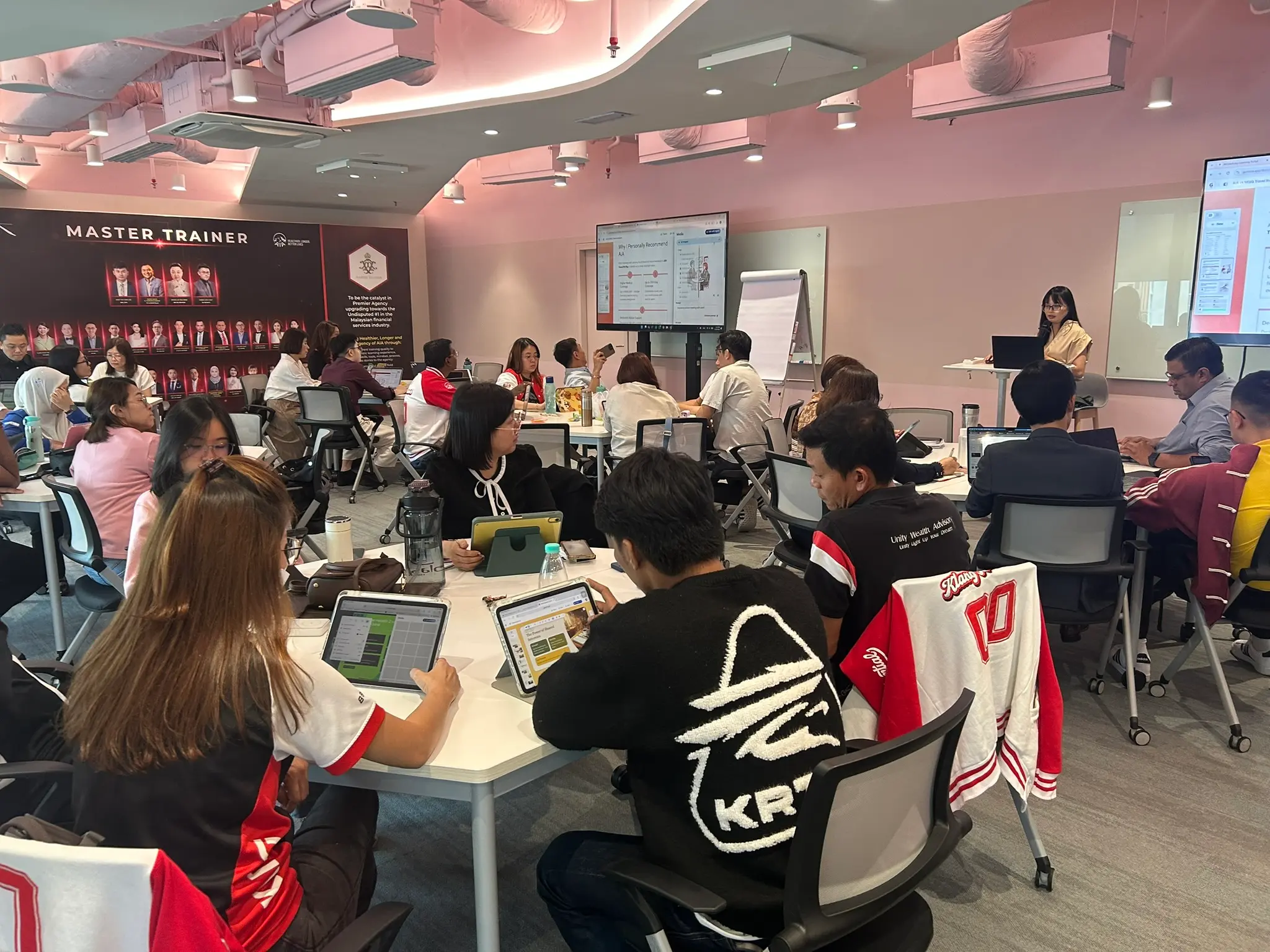 A packed room of AIA advisors following the AI-assisted sales training