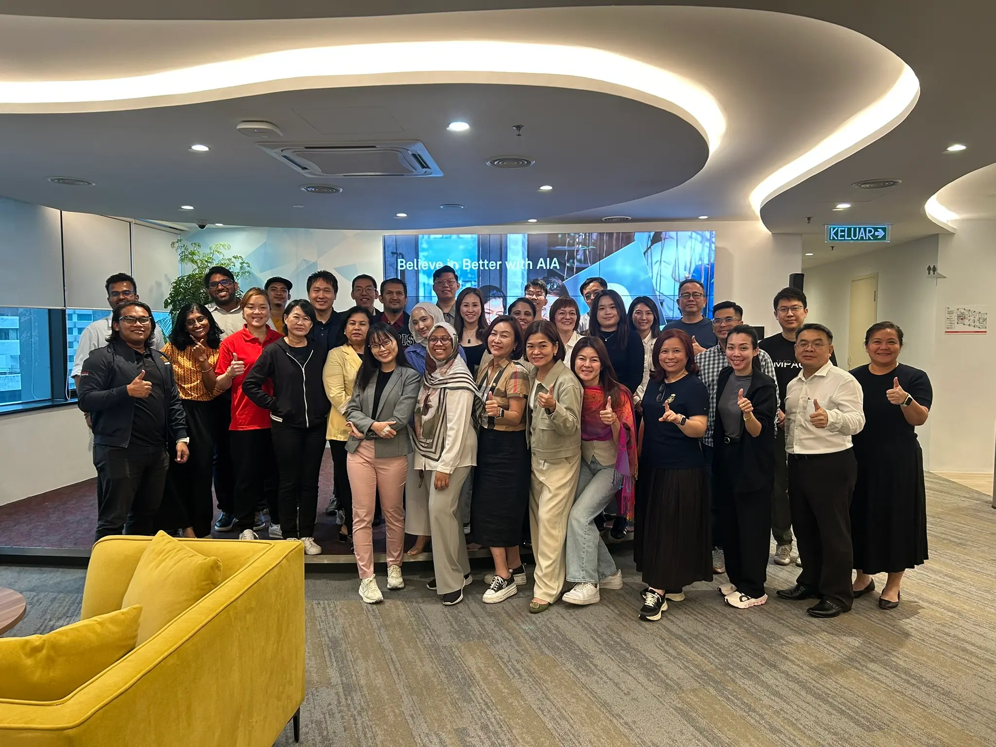 A large group of advisors and trainers posing together at the end of a full-day AI training session in Kuala Lumpur, 17 September 2026