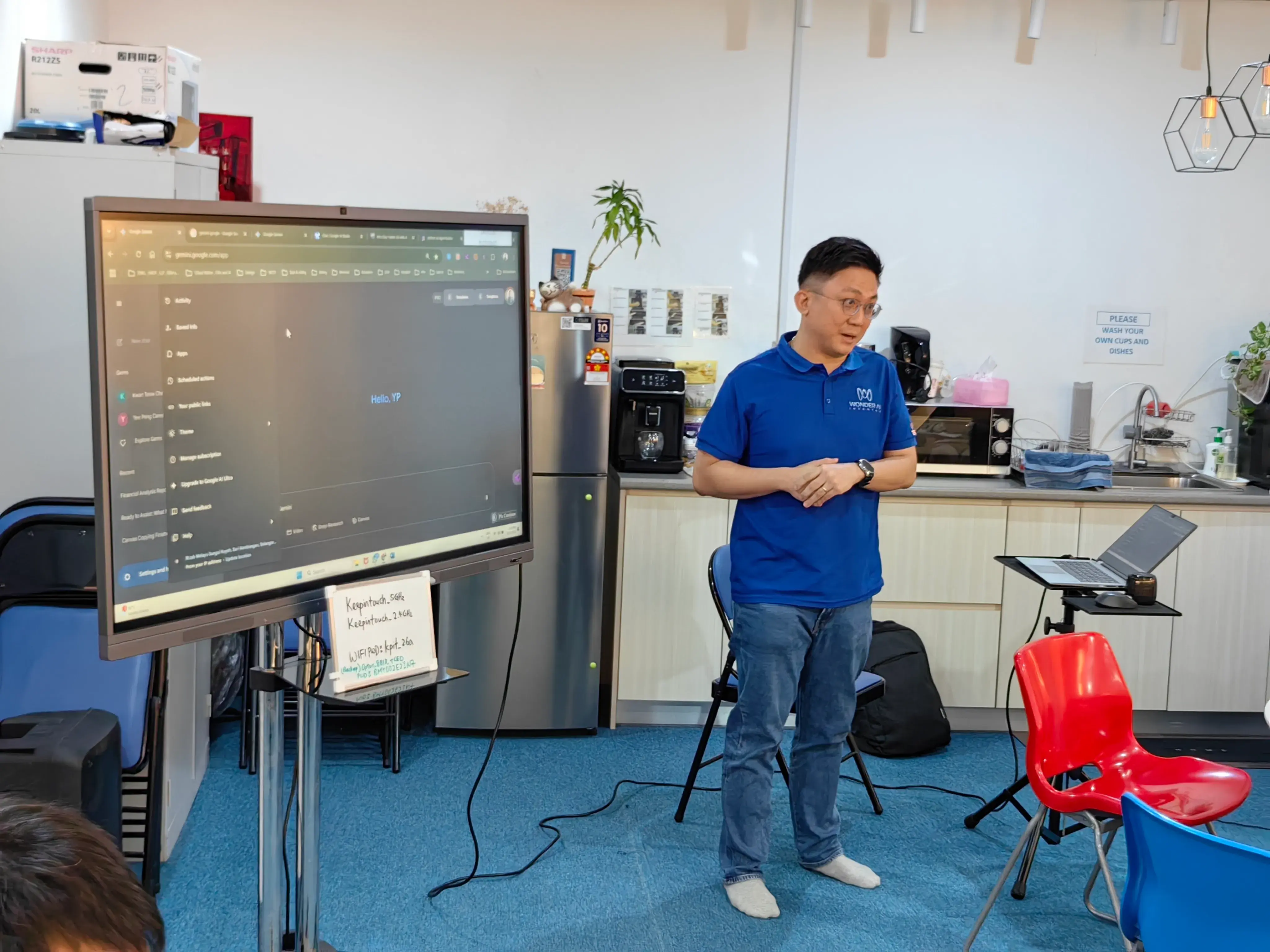 Speaker in a blue polo presenting with Google Gemini open on the screen at Inno Day #1
