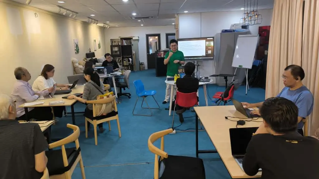Participants seated with laptops during the building session at Inno Day #2