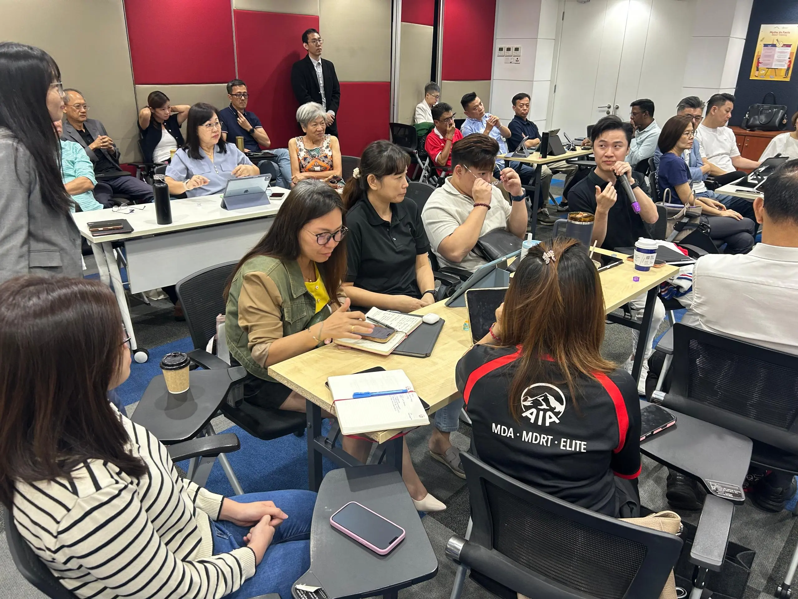The trainer presenting a practice exercise slide to the room