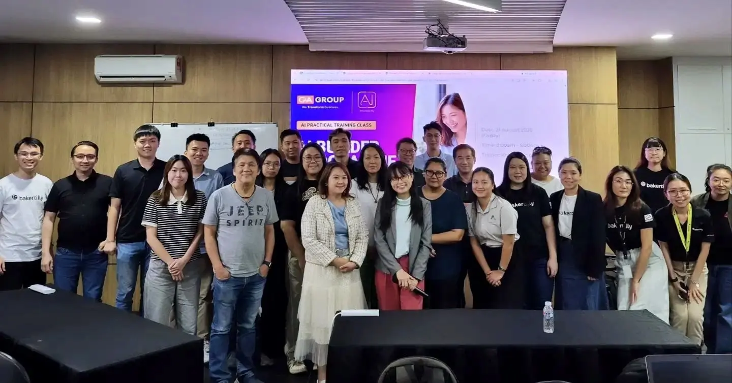 The full group standing together in front of the programme slide at the end of the day