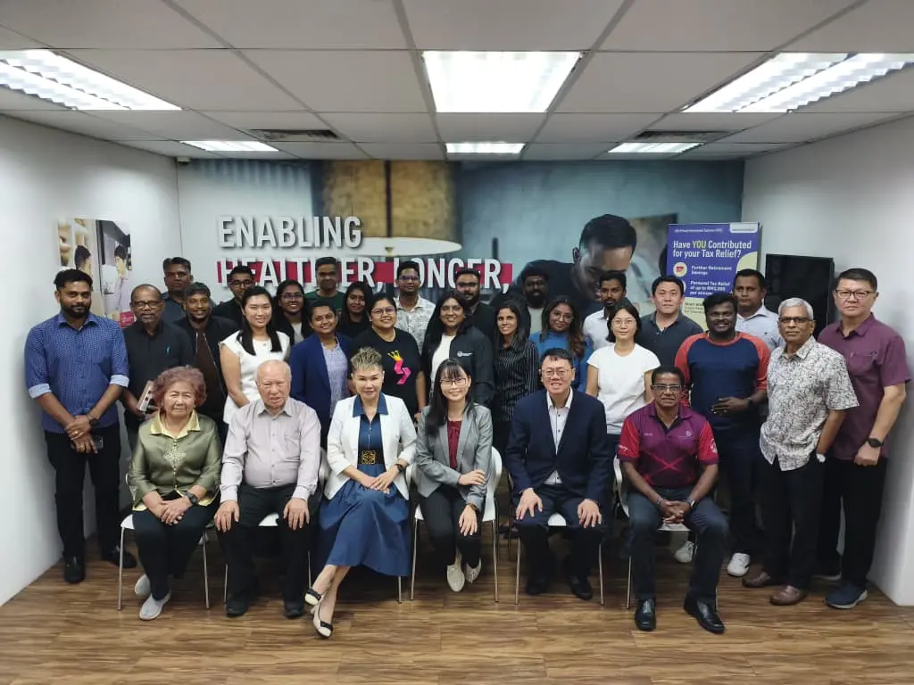 A large group of advisors and trainers posing together at the end of a full-day AI training session in Seremban, 18 September 2026