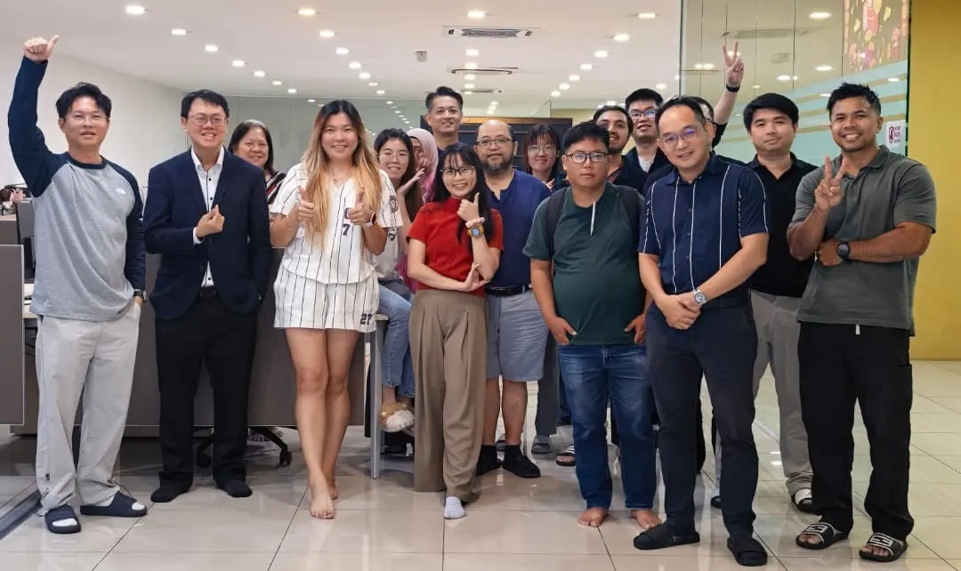 Group photo of participants and trainers with thumbs up and peace signs at the end of the AI Essentials day, 5 September 2026