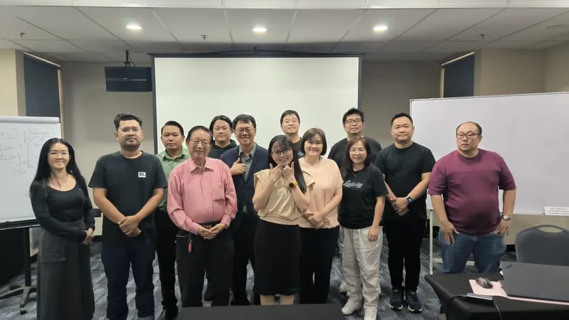 Group photo of public AI Essentials training participants with trainers in meeting room
