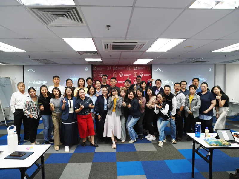 Group photo of corporate team and trainers at the Productivity Booster with AI training session in Ipoh