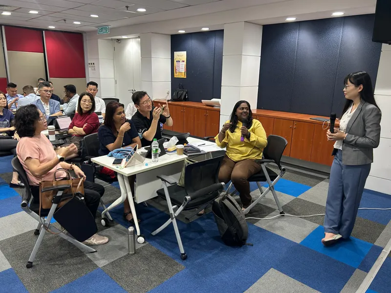 Trainer leading an interactive question and answer session with participants