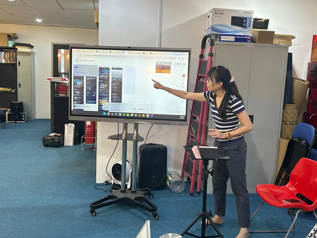 Koh Li Hong showing app interfaces generated from plain text prompts at Inno Day #6